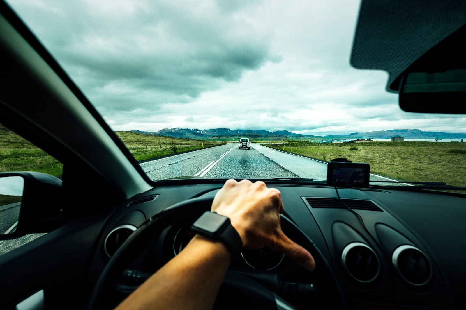 person driving car near vehicle under nimbus cloudes, auto